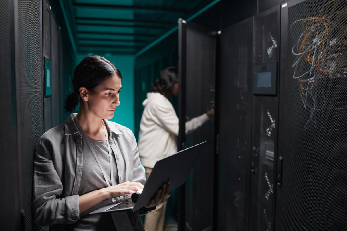 two-women-working-in-data-center-JF553JD